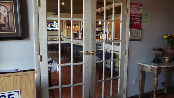 Old fashioned French doors leading to the lounge area at Fratelli Restaurant in Wallingford, CT